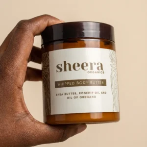Sheera Organics - A Hand holding a Branded Product Label of Sheera Organics